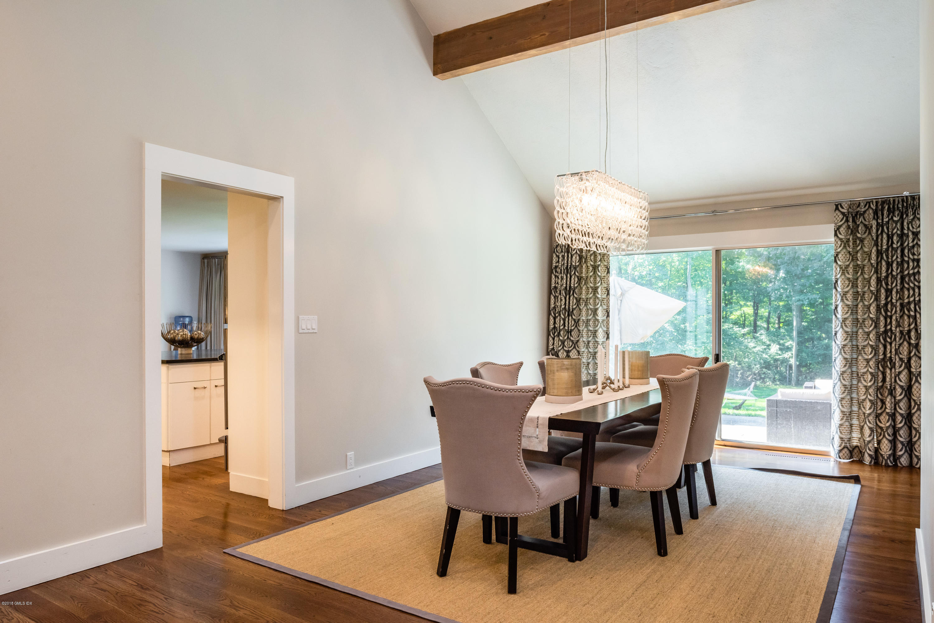84 Burning Tree Road Greenwich, CT 06830 - Photo 10 of 28 a view of a dining room with furniture window and wooden floor