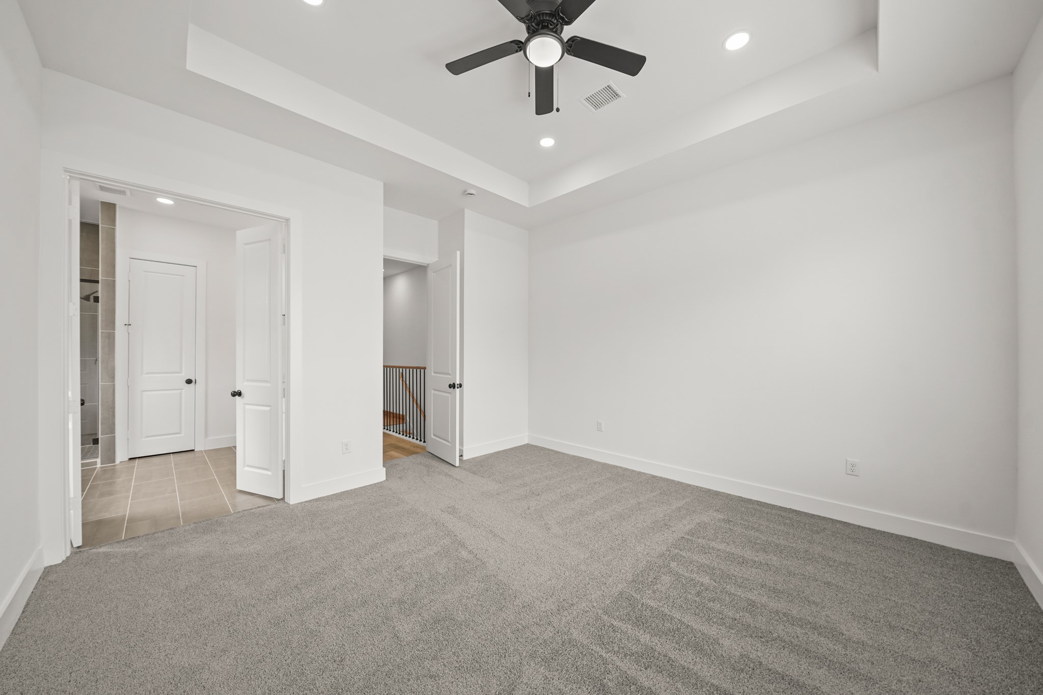 3419 Tuam Street Houston, TX 77004 - Photo 12 of 28 an empty room with a ceiling fan and carpet