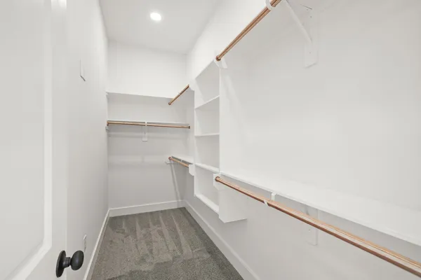 a view of an empty walk in closet