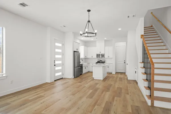 a view of a kitchen with wooden floor