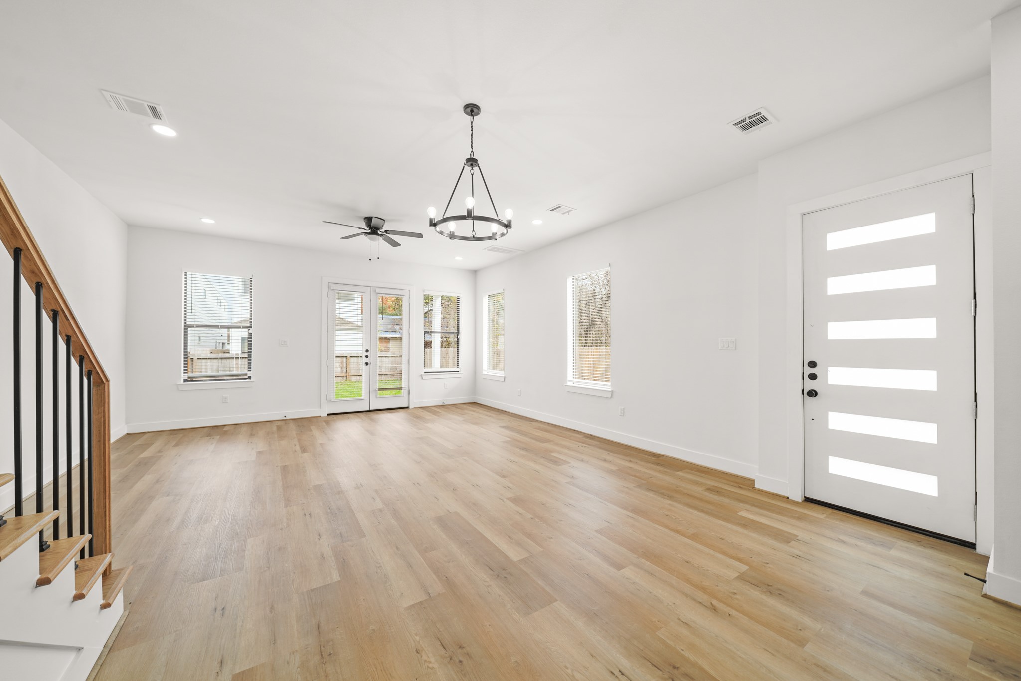 3419 Tuam Street Houston, TX 77004 - Photo 7 of 28 a view of a livingroom with wooden floor and windows