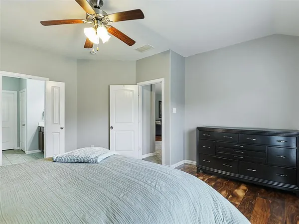 a bed room with a bed and a chandelier
