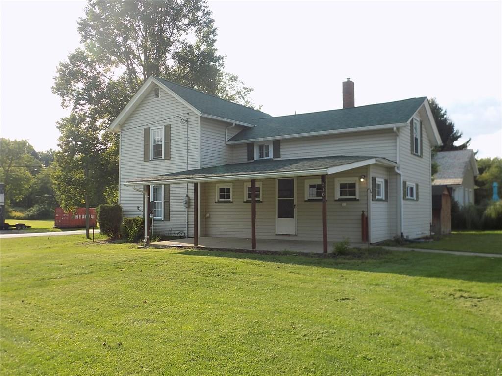 2303 Mercer Road Stoneboro, PA 16153 - Photo 1 of 22 a front view of a house with a yard