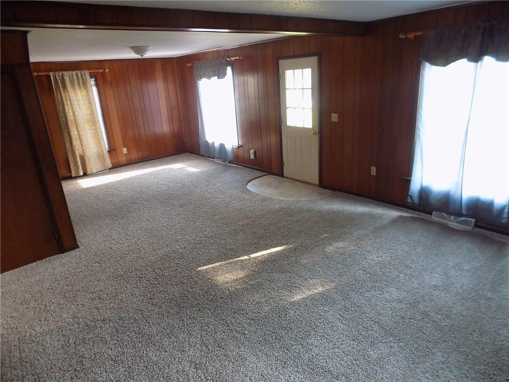 2303 Mercer Road Stoneboro, PA 16153 - Photo 11 of 22 a view of a livingroom with an empty space and a window