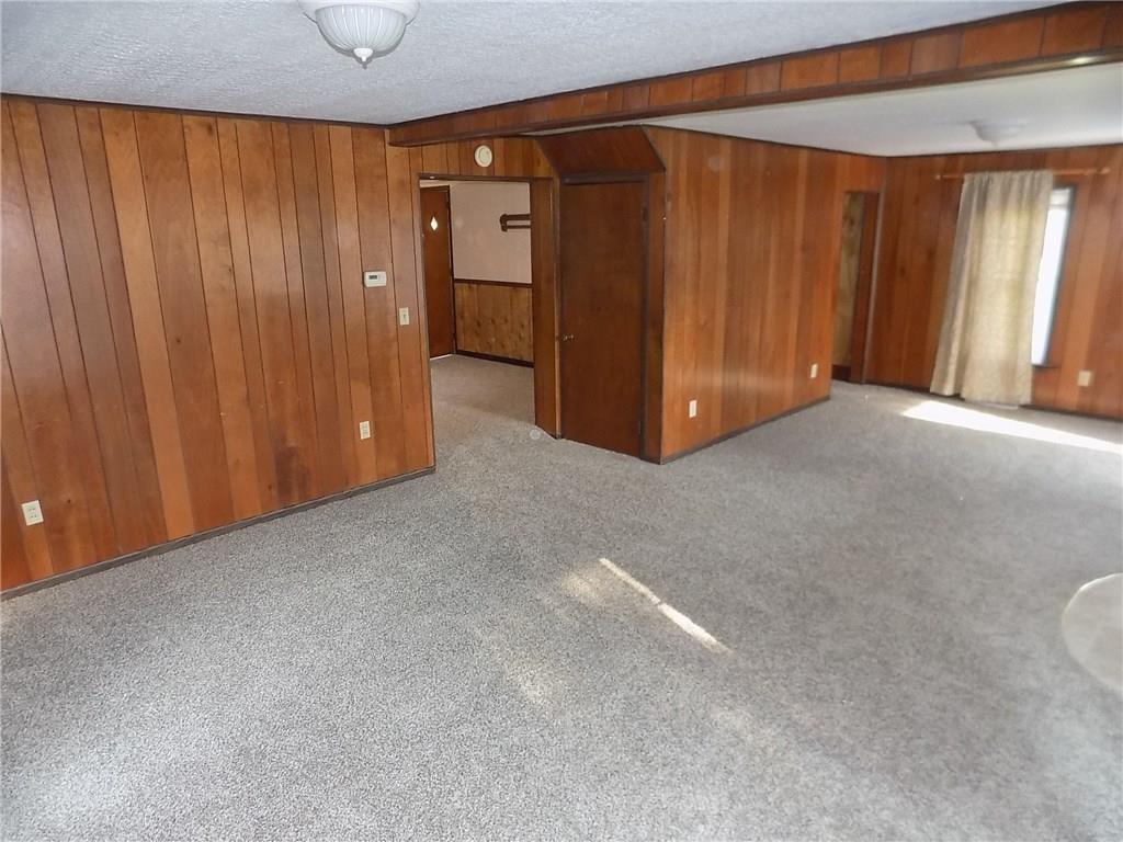 2303 Mercer Road Stoneboro, PA 16153 - Photo 12 of 22 a view of a livingroom with wooden walls