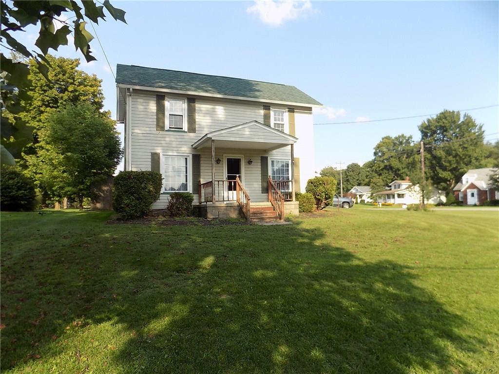 2303 Mercer Road Stoneboro, PA 16153 - Photo 21 of 22 a front view of a house with garden
