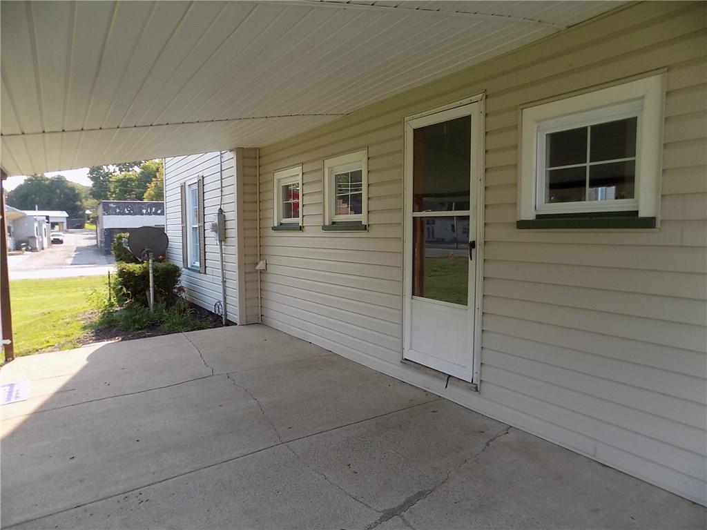 2303 Mercer Road Stoneboro, PA 16153 - Photo 5 of 22 a view of a house with a backyard