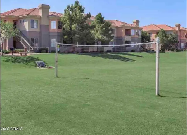 a view of a house with a backyard and a back yard