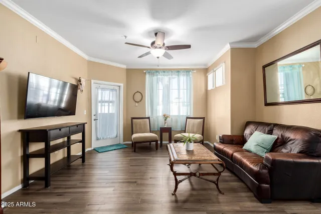 a living room with furniture and a flat screen tv