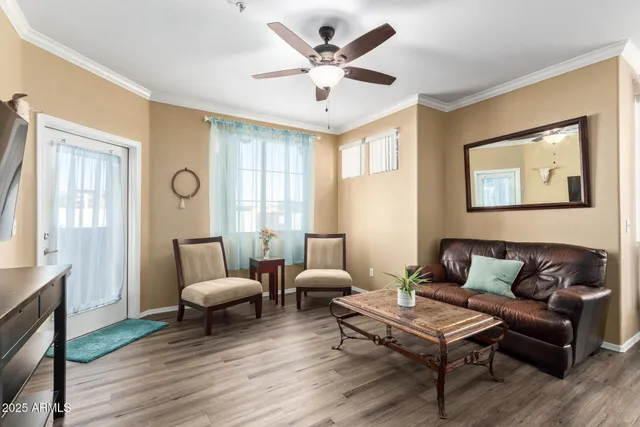 a living room with furniture and a large window