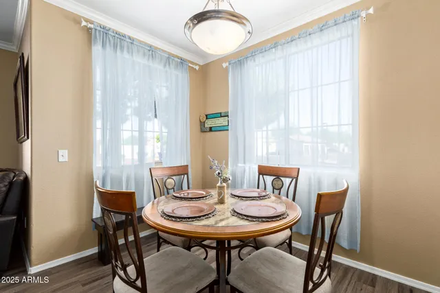 a view of a dining room with furniture and window