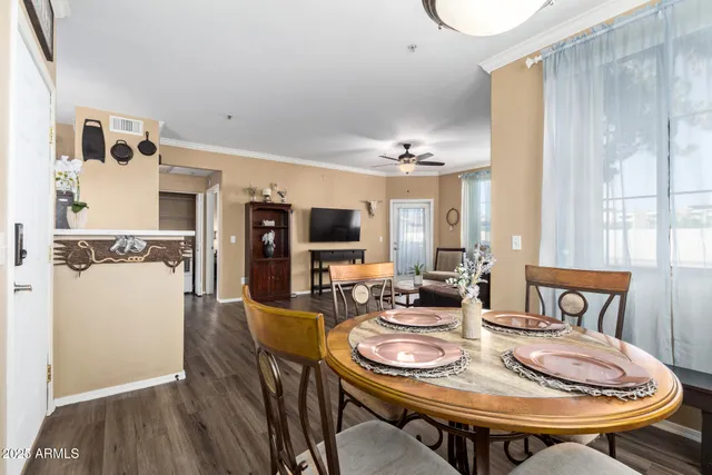 a view of a dining room with furniture and wooden floor