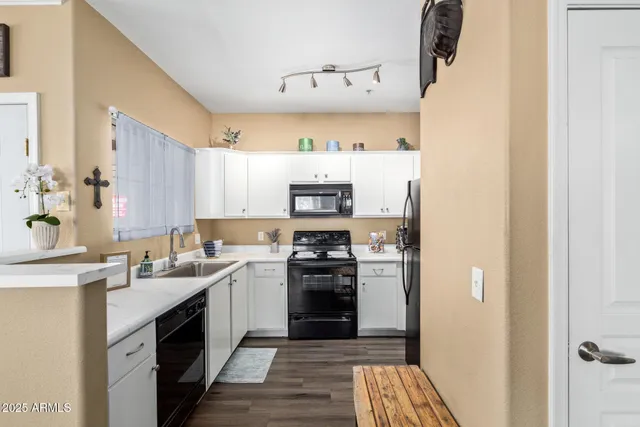 a kitchen with a sink stove and refrigerator