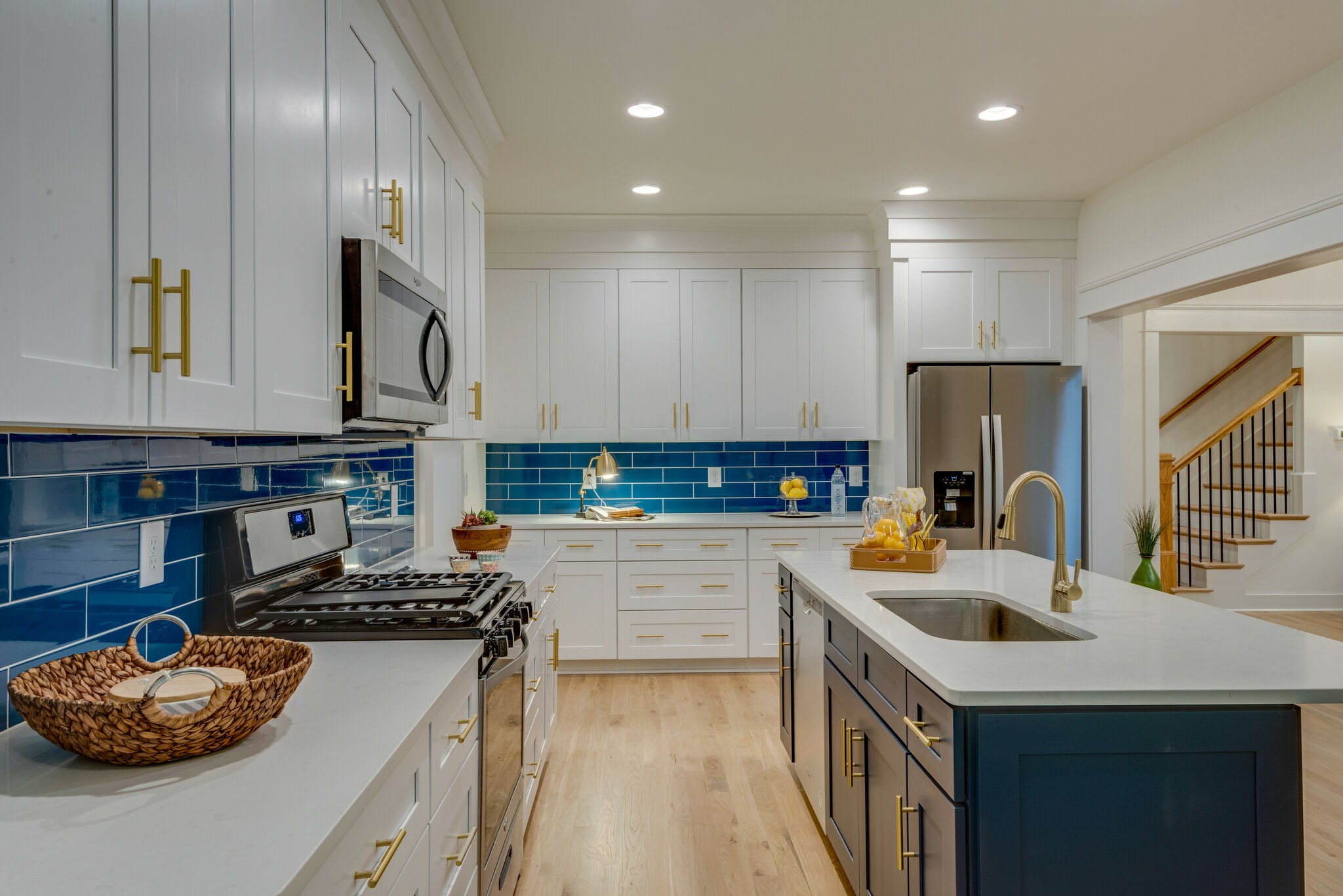 1106 Garton Road Burns, TN 37029 - Photo 12 of 46 a kitchen with stainless steel appliances granite countertop a sink stove and cabinets