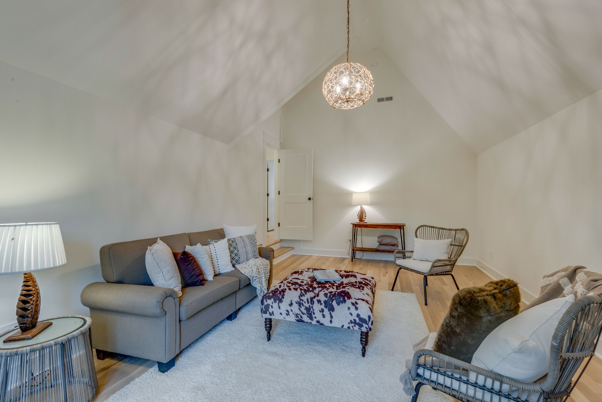 1106 Garton Road Burns, TN 37029 - Photo 20 of 46 a living room with furniture and a chandelier