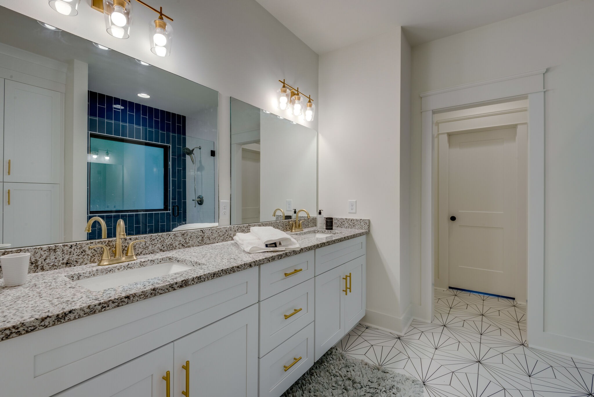 1106 Garton Road Burns, TN 37029 - Photo 26 of 46 a bathroom with a granite countertop sink double and mirror