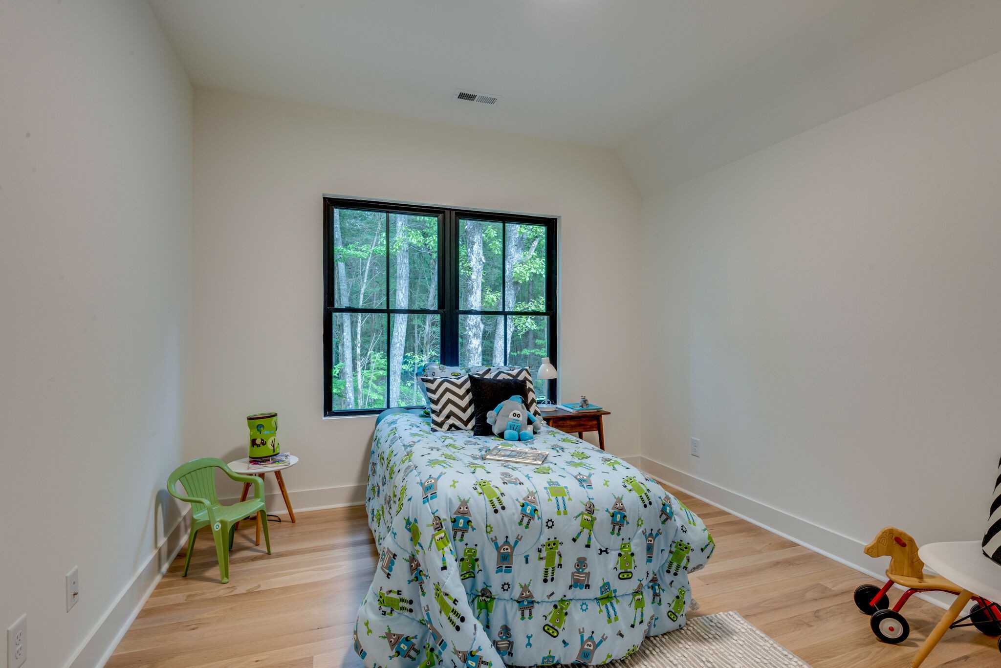 1106 Garton Road Burns, TN 37029 - Photo 29 of 46 a bed sitting in a bedroom next to a window