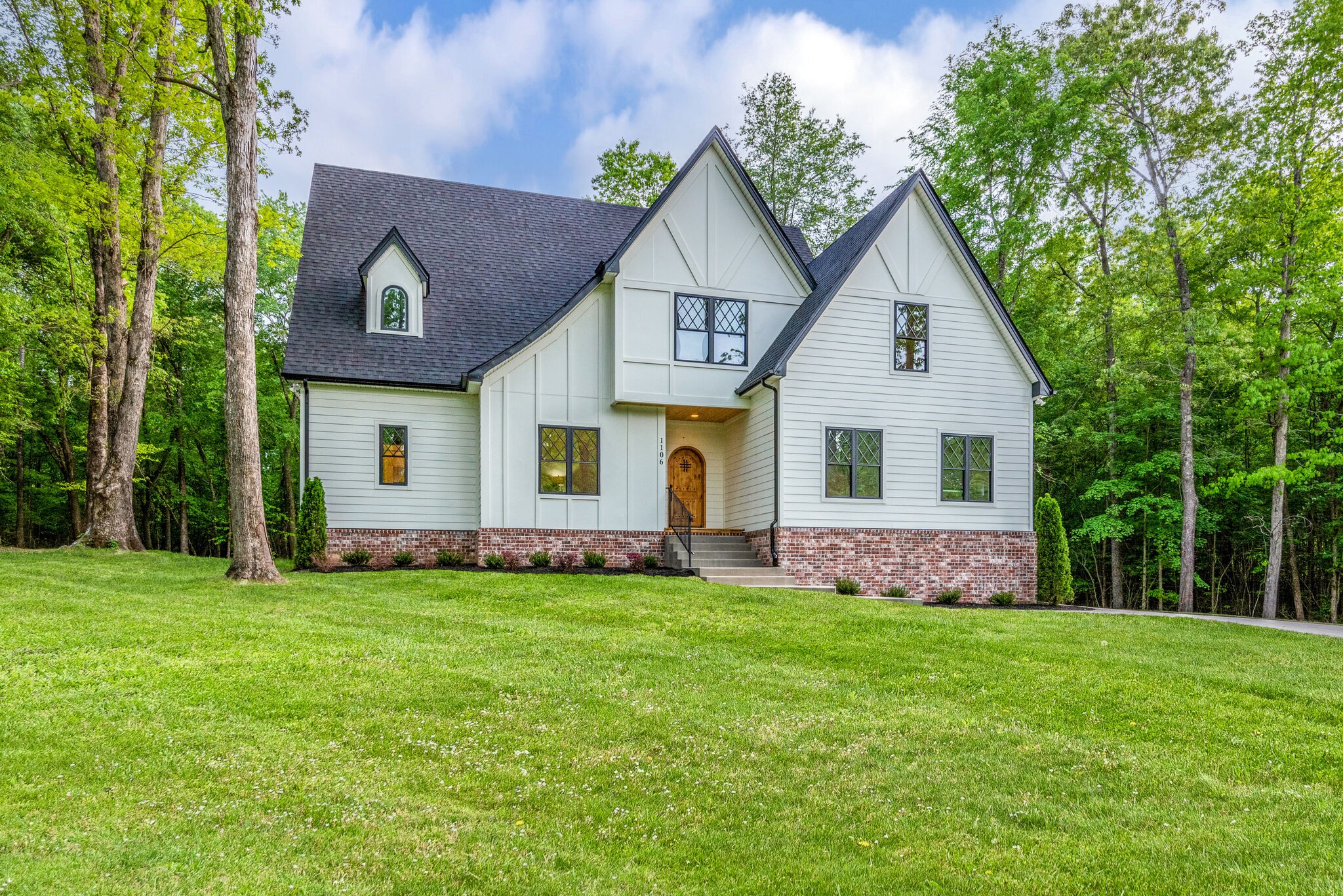 1106 Garton Road Burns, TN 37029 - Photo 36 of 46 a view of a house with a yard and garden