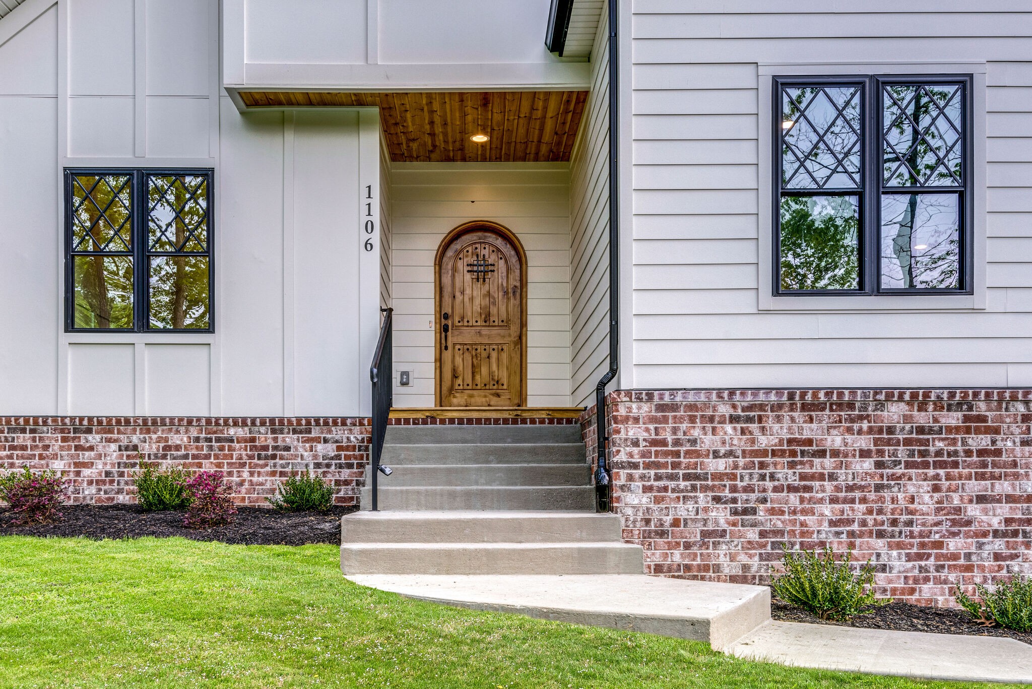1106 Garton Road Burns, TN 37029 - Photo 37 of 46 a front view of a house with garden
