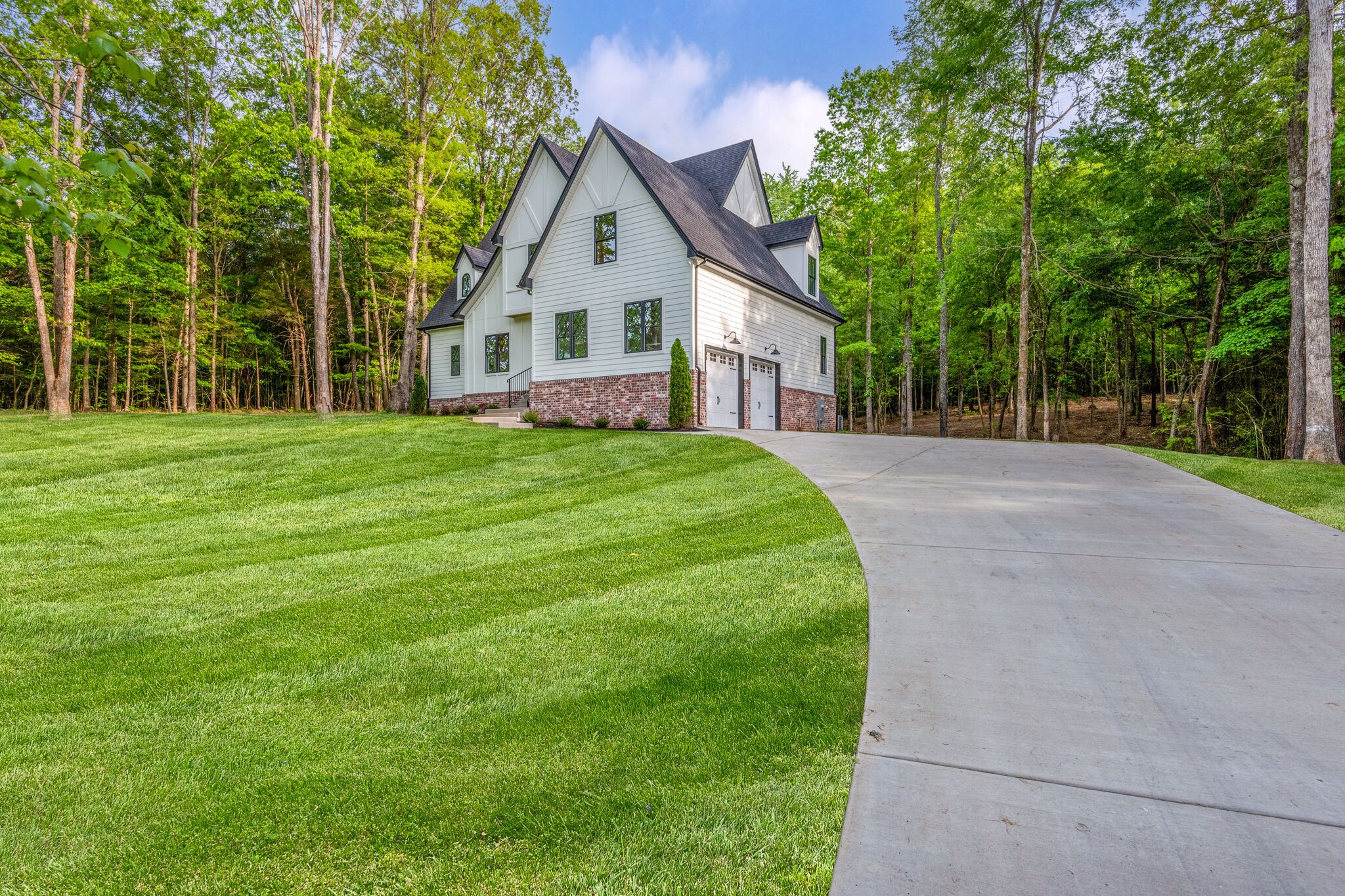 1106 Garton Road Burns, TN 37029 - Photo 38 of 46 a front view of a house with a yard
