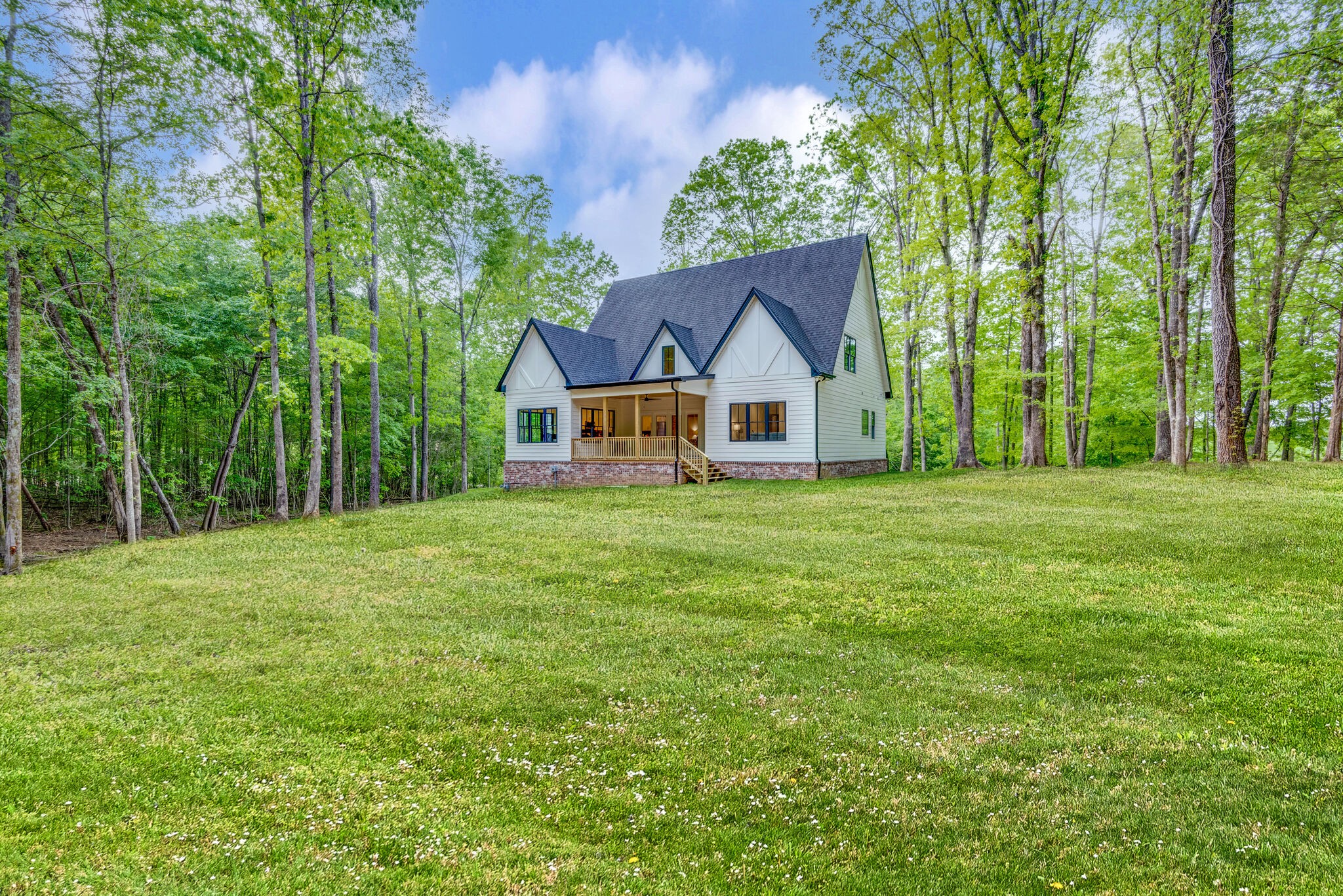 1106 Garton Road Burns, TN 37029 - Photo 42 of 46 a front view of a house with yard