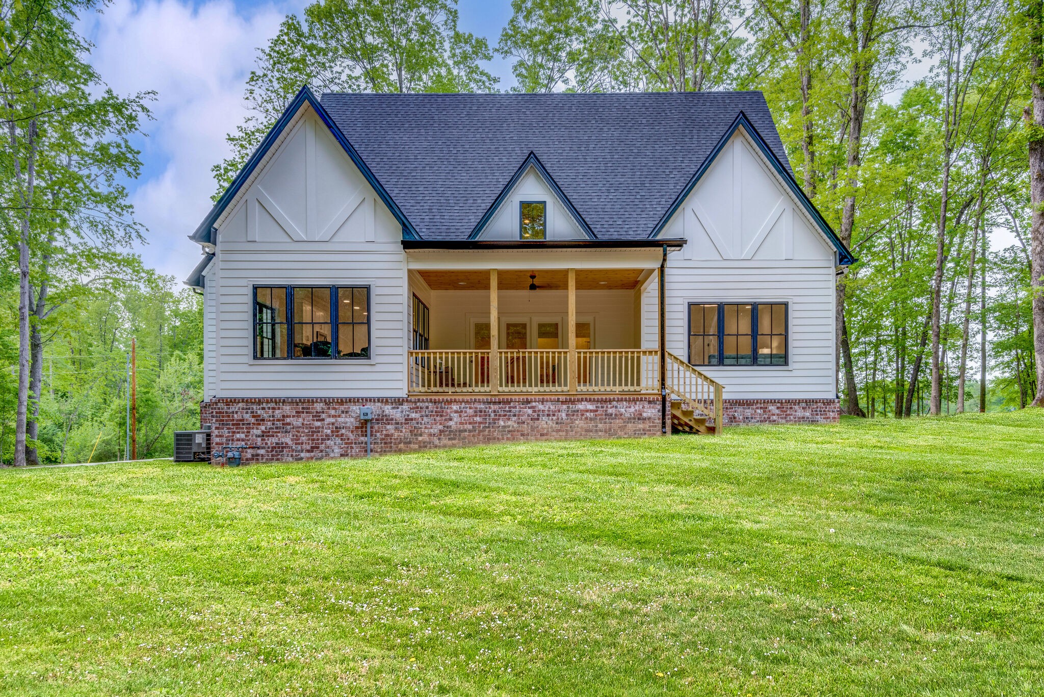 1106 Garton Road Burns, TN 37029 - Photo 44 of 46 a front view of a house with a garden