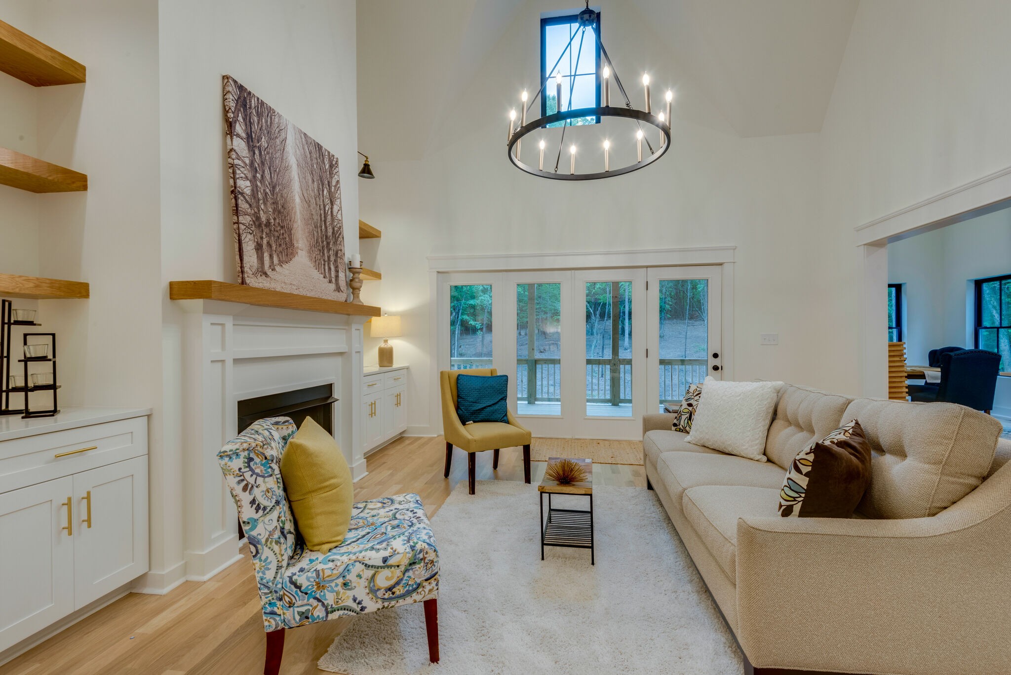 1106 Garton Road Burns, TN 37029 - Photo 5 of 46 a living room with furniture a chandelier and a fireplace