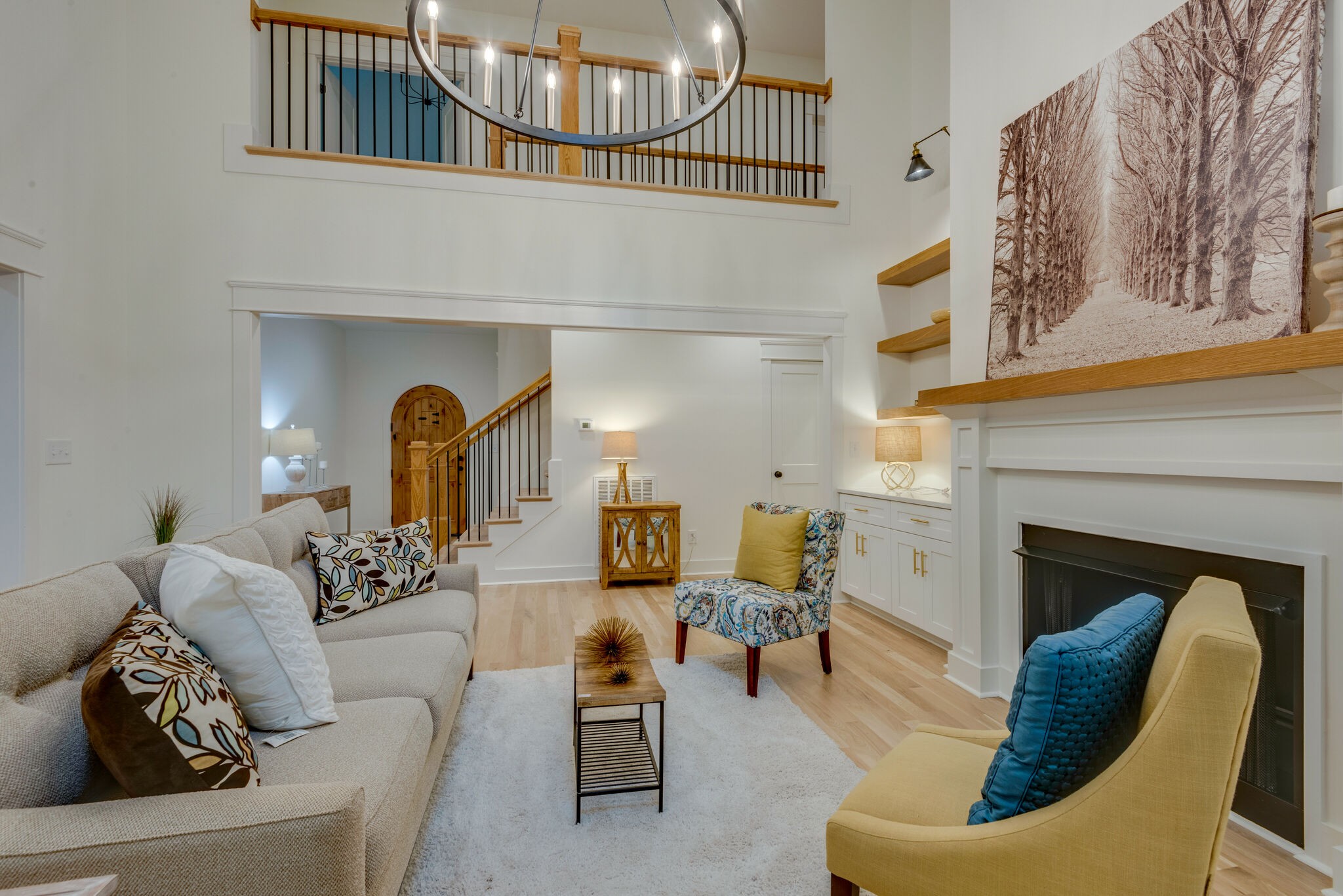 1106 Garton Road Burns, TN 37029 - Photo 9 of 46 a living room with furniture a fireplace and a chandelier