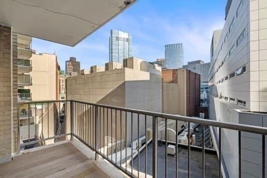 a bathroom with a granite countertop sink a mirror and shower