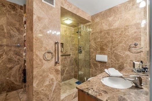 a spacious bathroom with a bathtub and shower