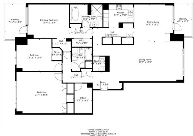 a front view of a building with a garden