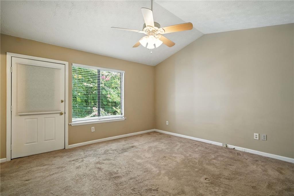 3045 Wildflower Lane Southwest Snellville, GA 30039 - Photo 12 of 35 an empty room with a window