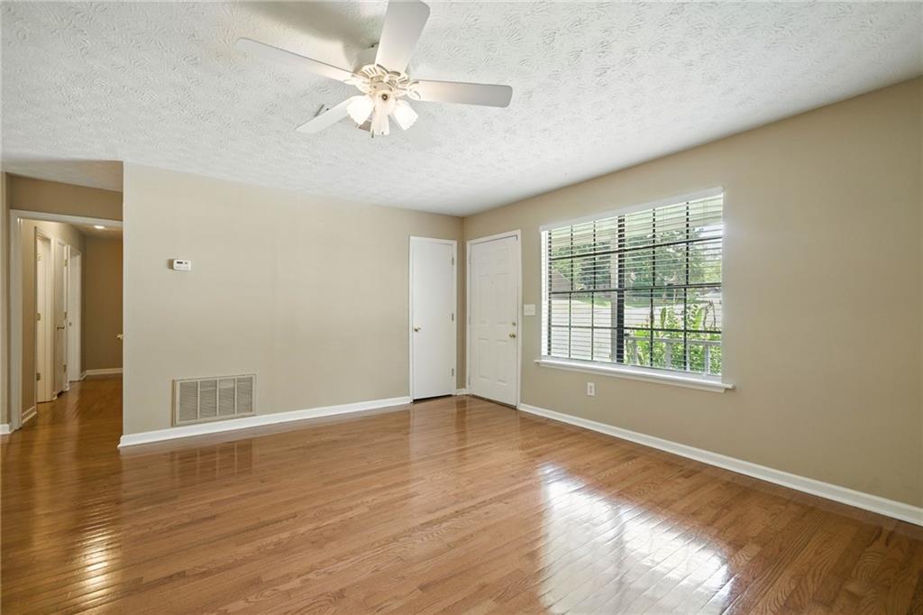 3045 Wildflower Lane Southwest Snellville, GA 30039 - Photo 20 of 35 wooden floor in an empty room with a window