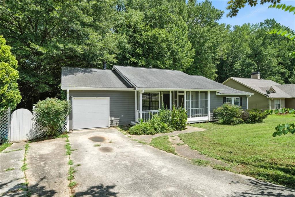 3045 Wildflower Lane Southwest Snellville, GA 30039 - Photo 24 of 35 a aerial view of a house with a yard and potted plants