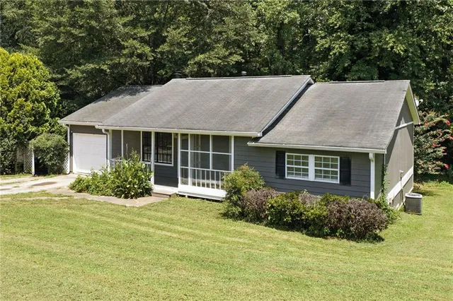 a view of balcony with floor to ceiling window and wooden fence