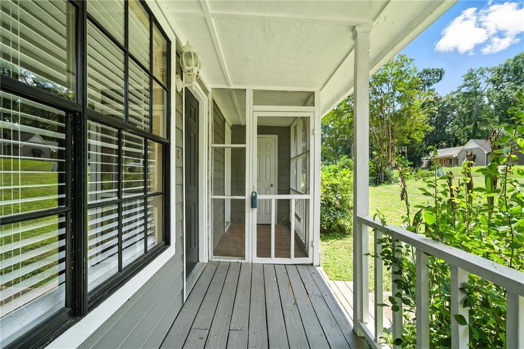 3045 Wildflower Lane Southwest Snellville, GA 30039 - Photo 26 of 35 a view of balcony with floor to ceiling window and wooden fence