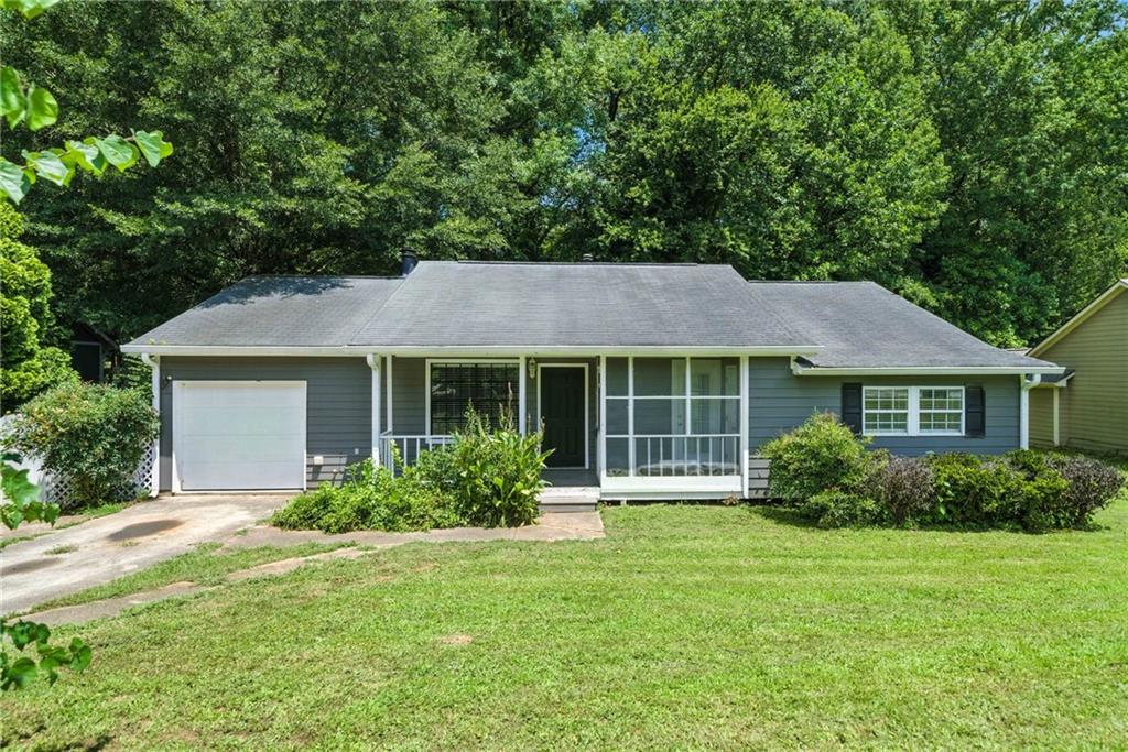 3045 Wildflower Lane Southwest Snellville, GA 30039 - Photo 27 of 35 a view of a house with garden and yard