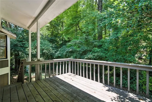 a view of a house with a tree in the yard