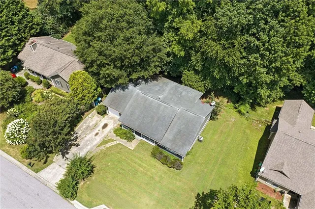 an aerial view of a house with yard swimming pool and outdoor seating