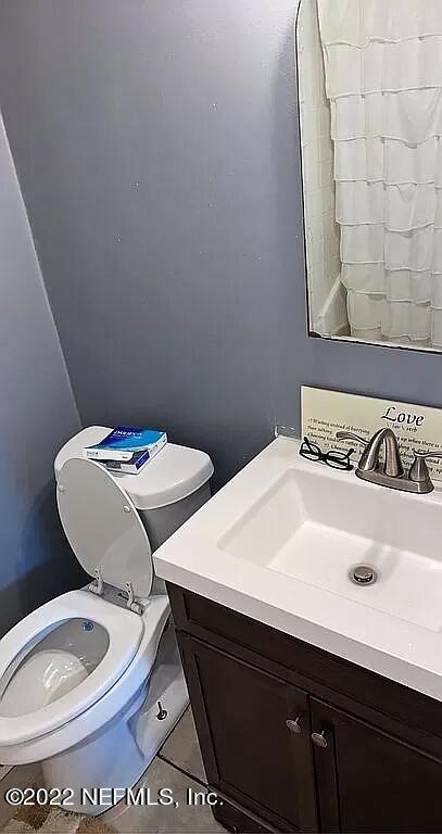 54148 Sherwood Road Callahan, FL 32011 - Photo 13 of 17 a bathroom with a sink and a mirror