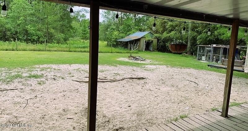 54148 Sherwood Road Callahan, FL 32011 - Photo 17 of 17 a view of a backyard with a garden
