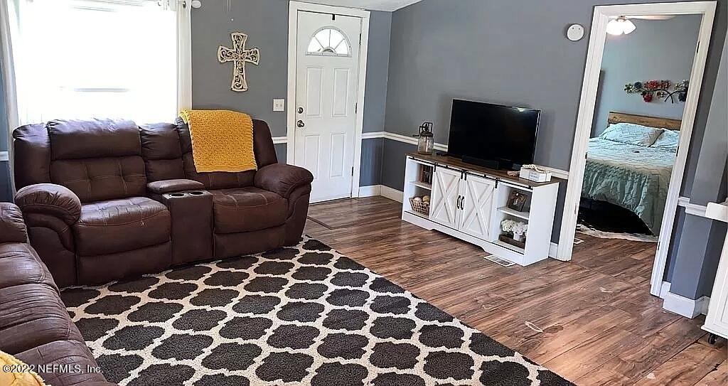 54148 Sherwood Road Callahan, FL 32011 - Photo 3 of 17 a living room with furniture and a flat screen tv