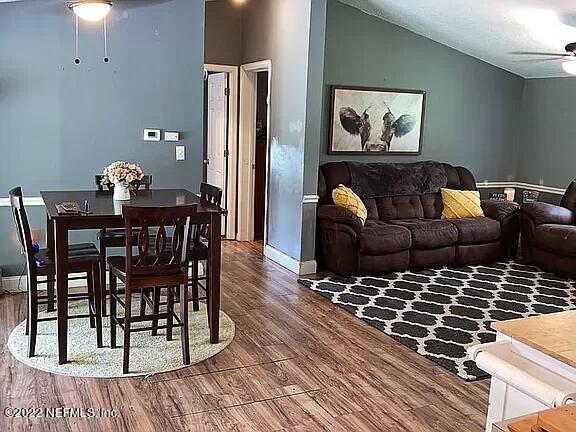54148 Sherwood Road Callahan, FL 32011 - Photo 4 of 17 a living room with furniture a wooden floor and next to a window