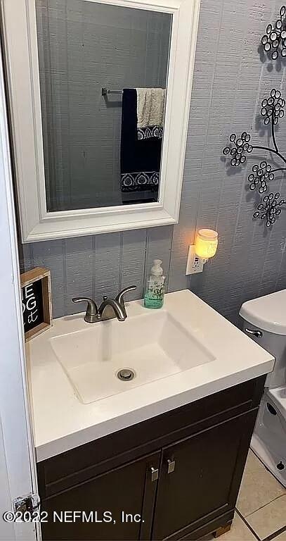 54148 Sherwood Road Callahan, FL 32011 - Photo 10 of 17 a bathroom with a sink and a mirror