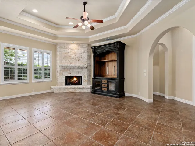 a large kitchen with stainless steel appliances kitchen island granite countertop a stove and a view of living room