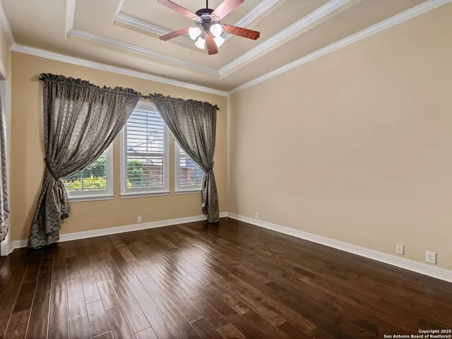 a spacious bathroom with a granite countertop sink and a mirror