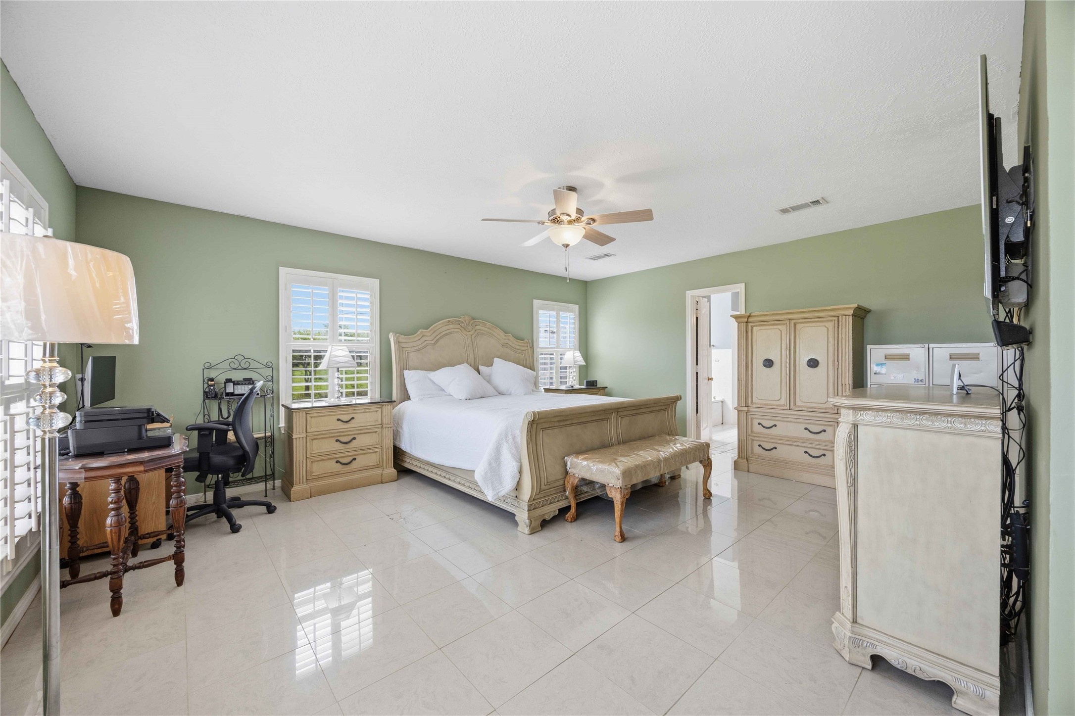 12075 Farm To Market 359 Hempstead, TX 77445 - Photo 27 of 46 a bedroom with a bed and a chandelier