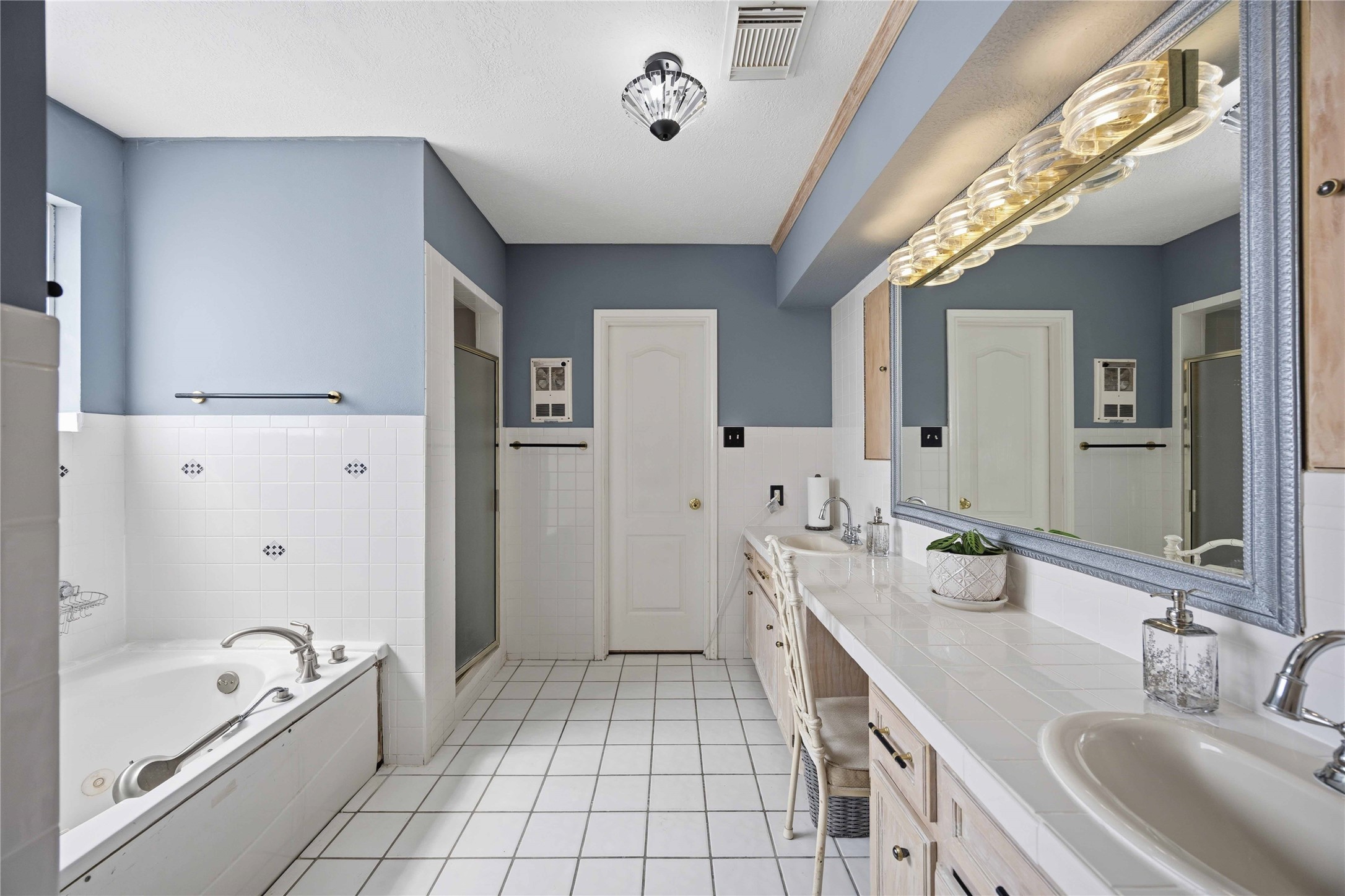 12075 Farm To Market 359 Hempstead, TX 77445 - Photo 29 of 46 a spacious bathroom with a tub sink and mirror