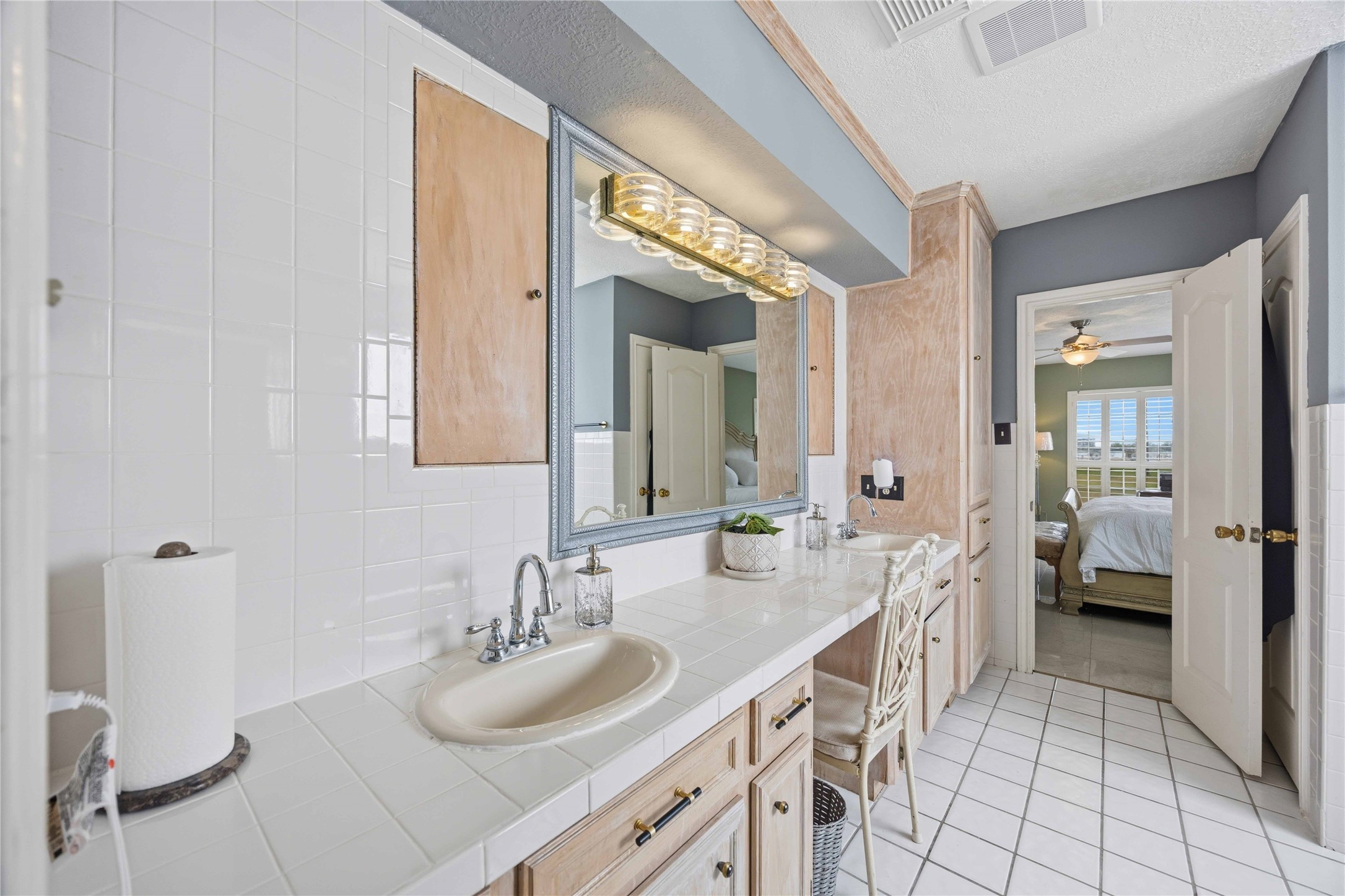 12075 Farm To Market 359 Hempstead, TX 77445 - Photo 30 of 46 a en suite bathroom with a double vanity sink a mirror and a shower