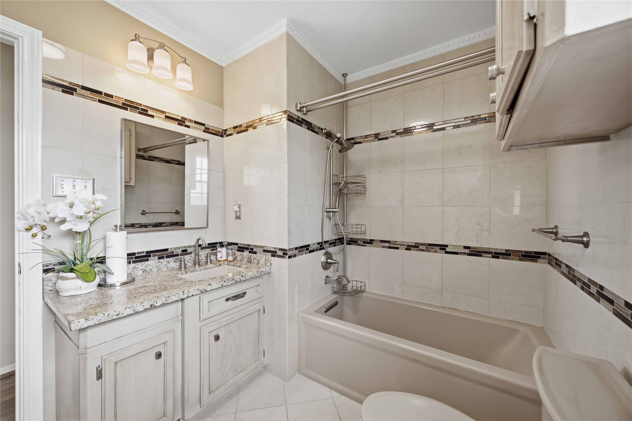 12075 Farm To Market 359 Hempstead, TX 77445 - Photo 33 of 46 a bathroom with a granite countertop sink a mirror a bathtub and shower